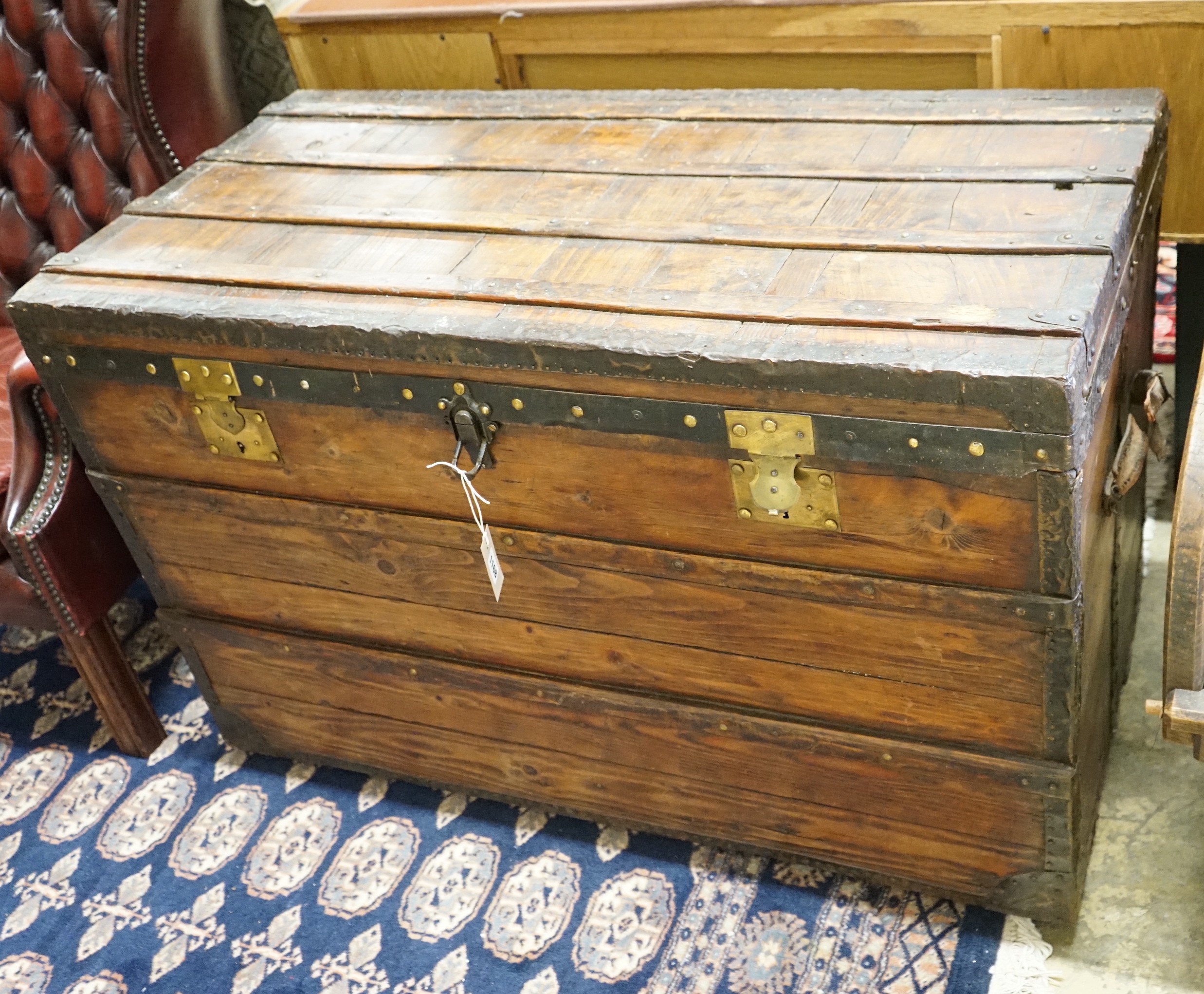 A Victorian iron and brass mounted trunk, length 109cm, depth 54cm, height 70cm